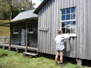 Kelly & Max painting windows frames, Mt Kate House (PD)