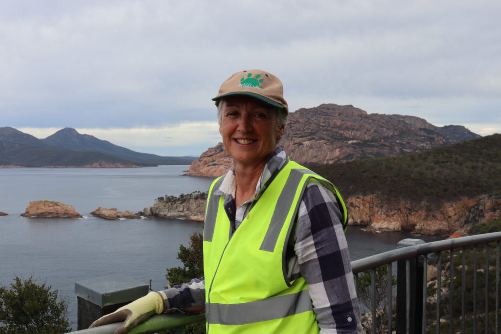 Woman leaning on a rail on a lookout