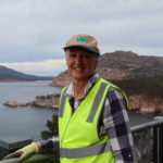 Woman leaning on a rail on a lookout